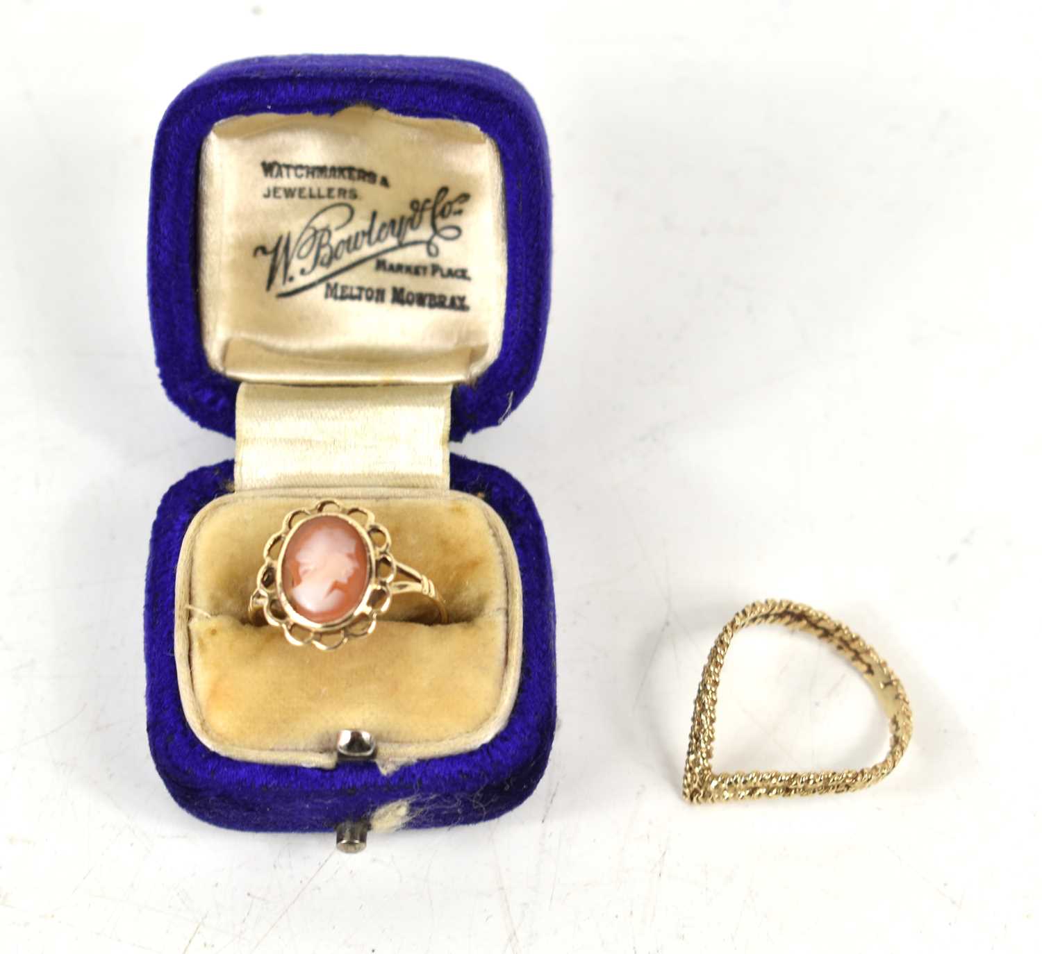 A 9ct gold wishbone ring, with rope twist detail, size O, 1.8g, and a 9ct gold cameo set ring,