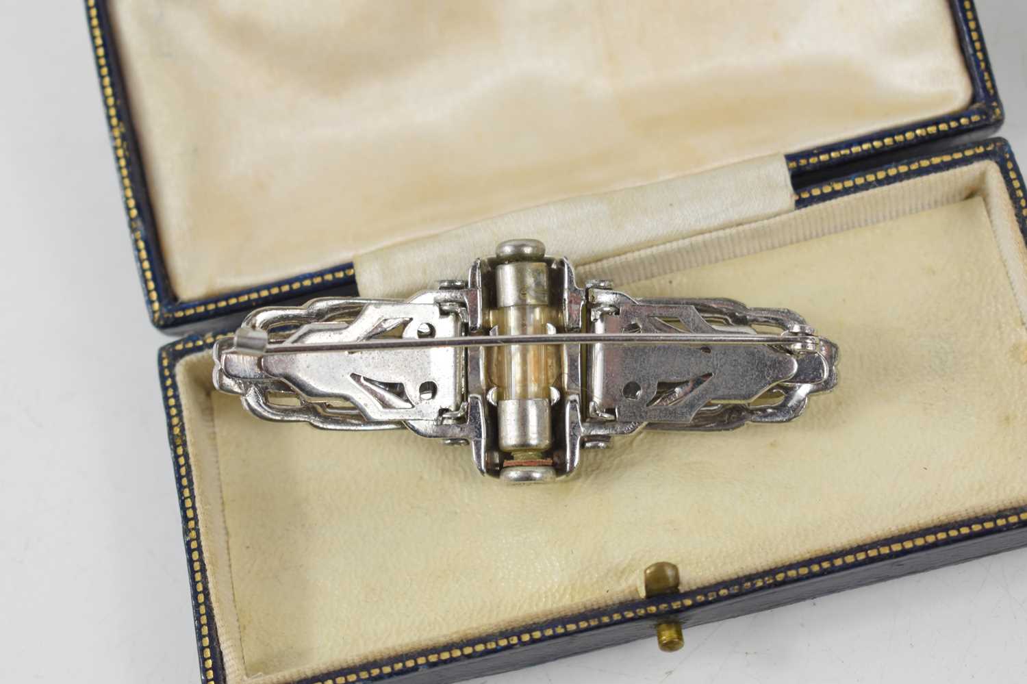 An Art Deco metamorphic dress brooch, inbuilt with a small glass perfume vial, both contained in a - Image 3 of 3