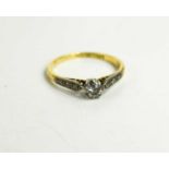 An 18ct gold and platinum diamond solitaire ring, the old cut diamond of approximately 0.25ct with