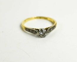 An 18ct gold and platinum diamond solitaire ring, the old cut diamond of approximately 0.25ct with