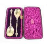 A pair of silver gilt spoons with orb and sceptre handles, hallmarked for Charles Boyton, London