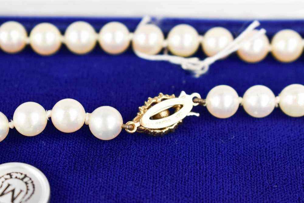 A Mikimoto pearl necklace, with a 9ct gold, pearl and pink sapphire set clasp, bearing makers - Image 3 of 4