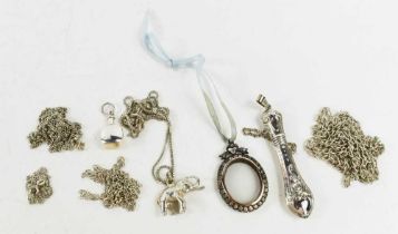 A group of silver jewellery comprising five silver chains, a past locket in the Victorian style,