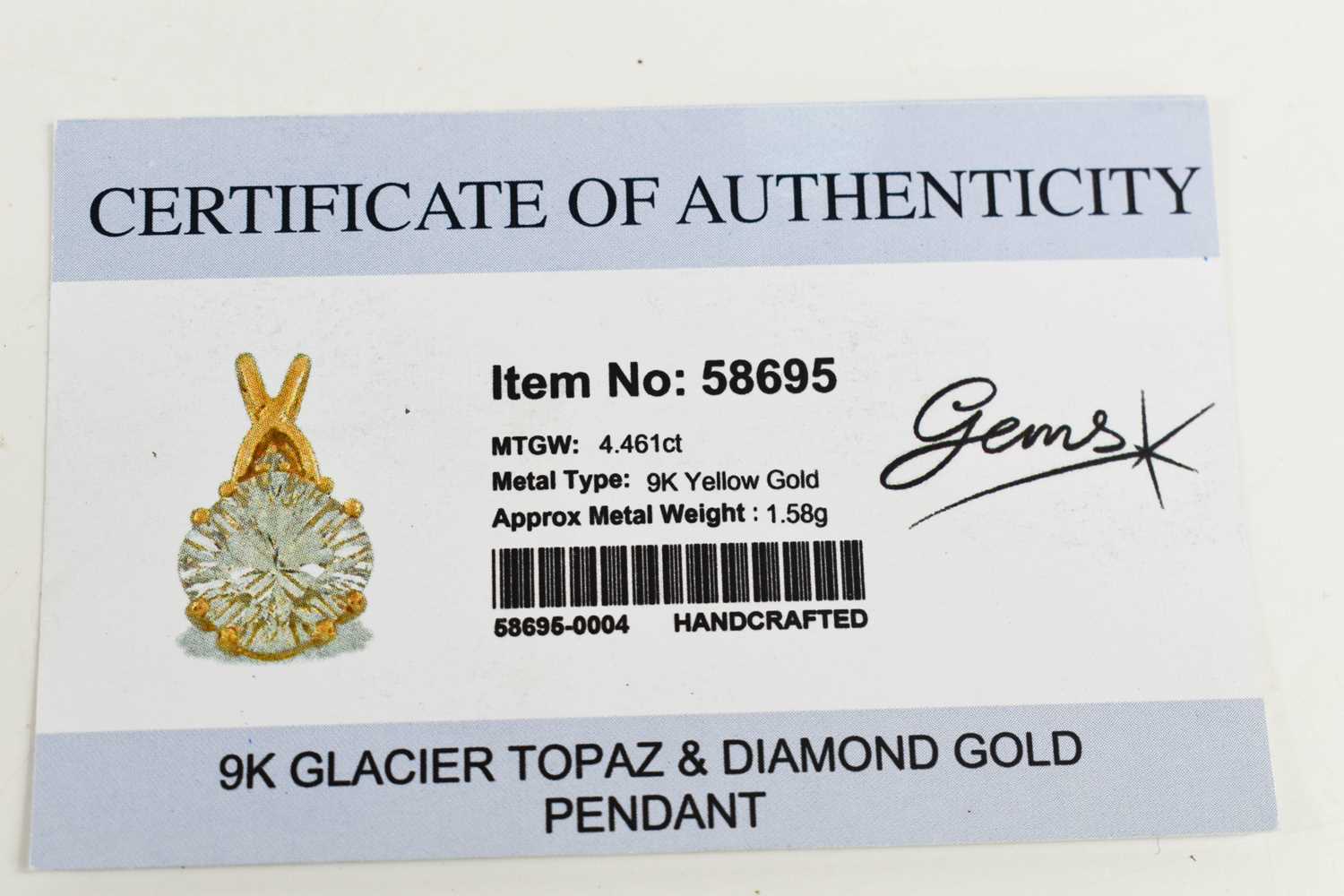 A glacier topaz and diamond pendant, the topaz of approximately 10.7mm diameter, with diamond - Image 2 of 2