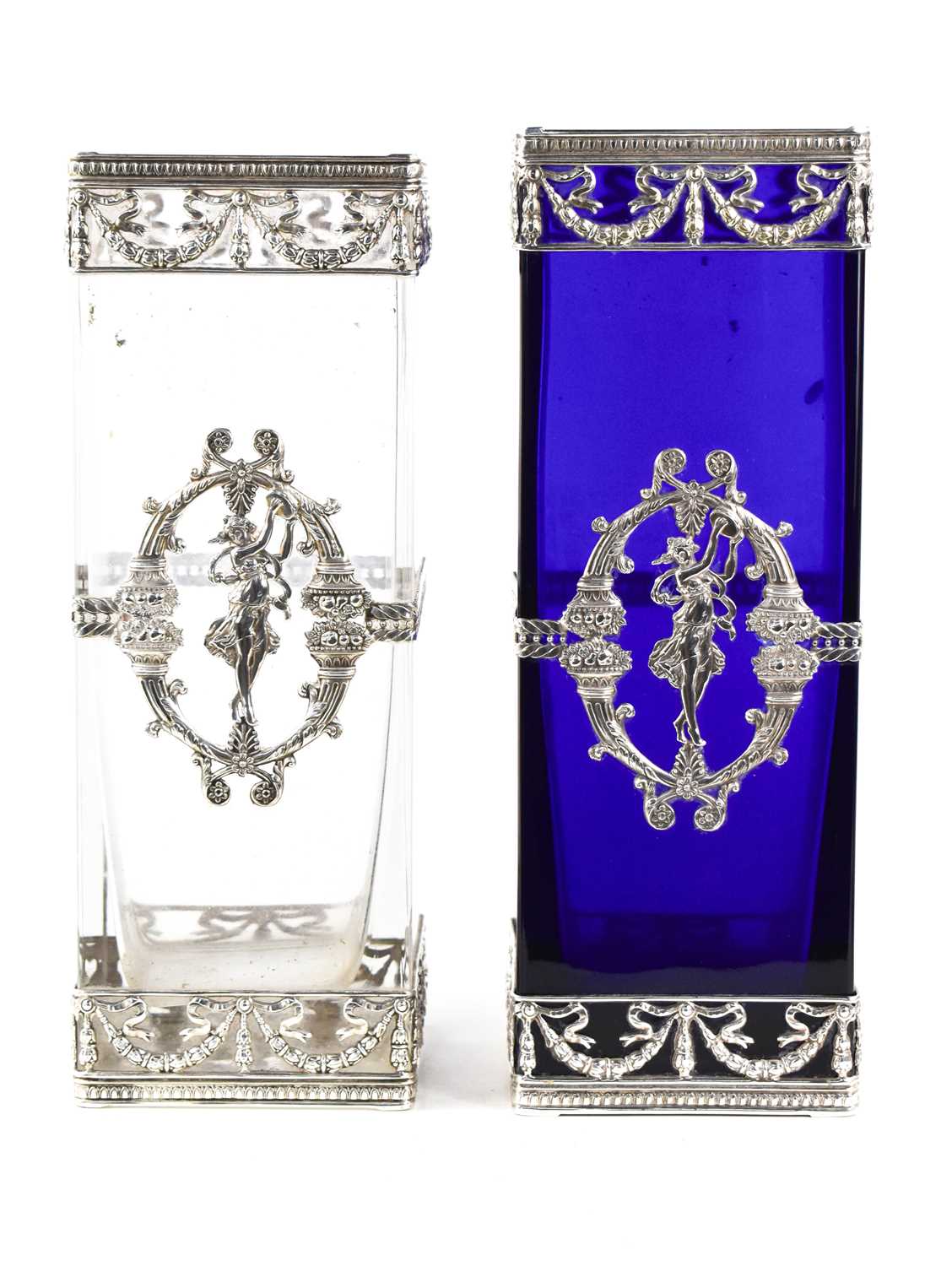 Two 19th century white metal and glass vases of rectangular form, the straight sided glass bodies