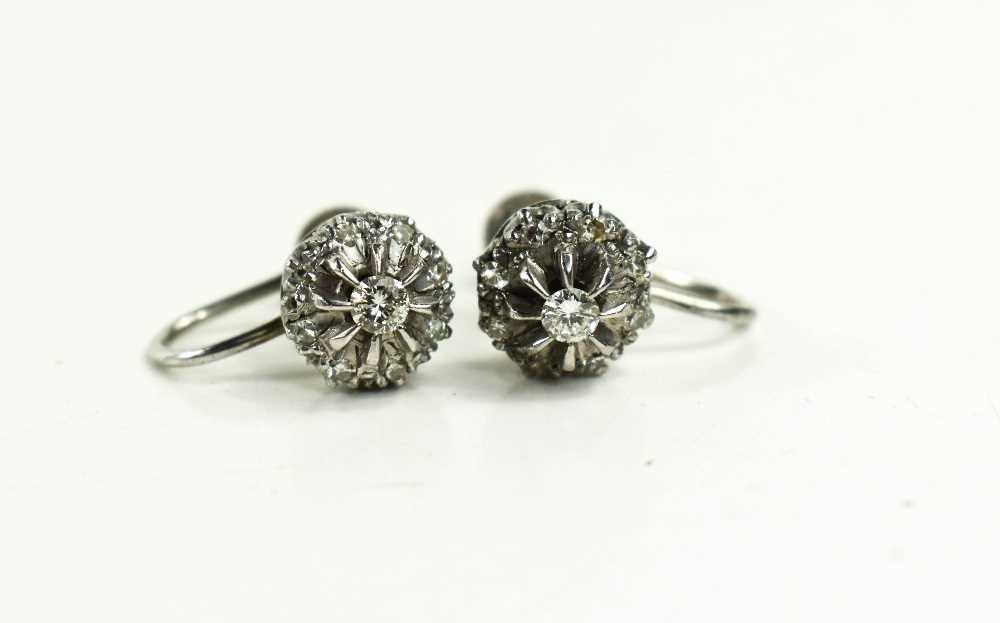 A pair of 9ct gold and diamond flowerhead earrings with screw on backs, 4.19g.