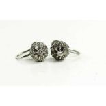 A pair of 9ct gold and diamond flowerhead earrings with screw on backs, 4.19g.