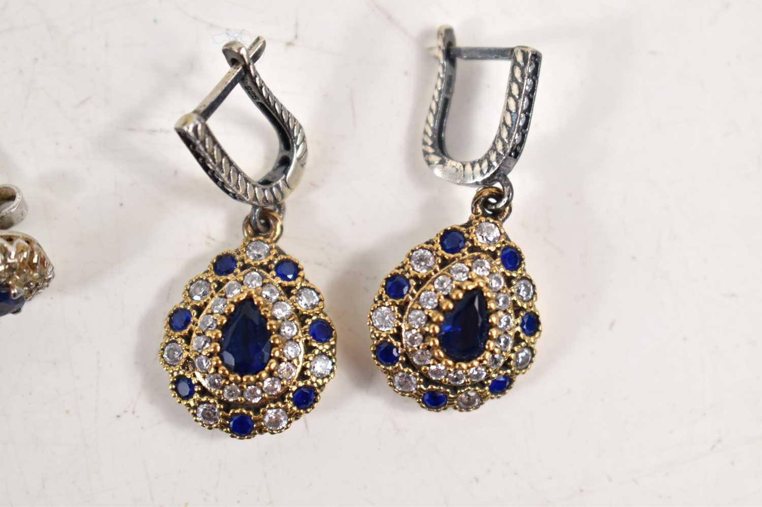 A pair of sapphire and diamond earrings, each set with a central sapphire, approximately 4.4mm - Image 2 of 4
