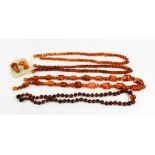 A group of Baltic amber necklaces, comprising angular beads, 52cm long, and two strings of