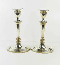 A pair of elegant silver candlesticks, Birmingham 1990, with weighted oval form bases, 30cm high.