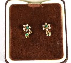 A pair of 9ct gold, diamond and emerald earrings of flowerhead form with emerald drops, each