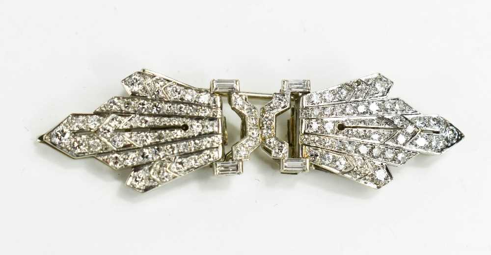An Art Deco Marcus & Co diamond set metamorphic brooch, likely platinum, each starburst clip set
