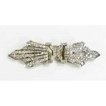 An Art Deco Marcus & Co diamond set metamorphic brooch, likely platinum, each starburst clip set