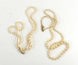 Two graduated single strand pearl necklaces with 9ct gold clasps.