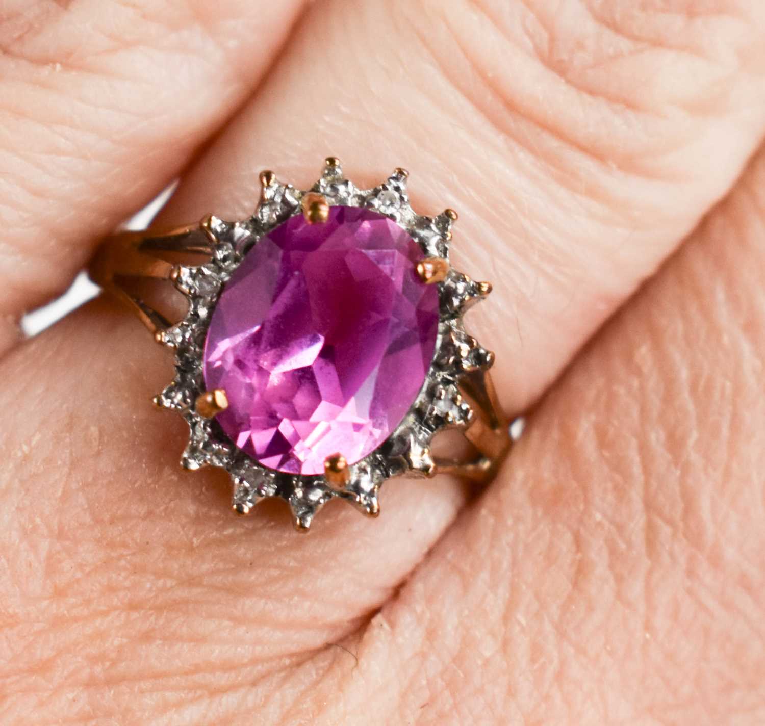 A 9ct gold, pink sapphire and diamond ring, size L½, 2.38g.