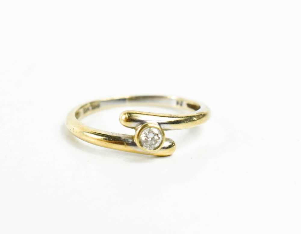 An 18ct gold and diamond ring, the bezel set solitaire of approximately 2.2mm diameter, in cross- - Image 2 of 2