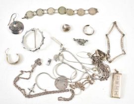 A group of jewellery to include a bracelet made from silver threepence coins, silver ingot