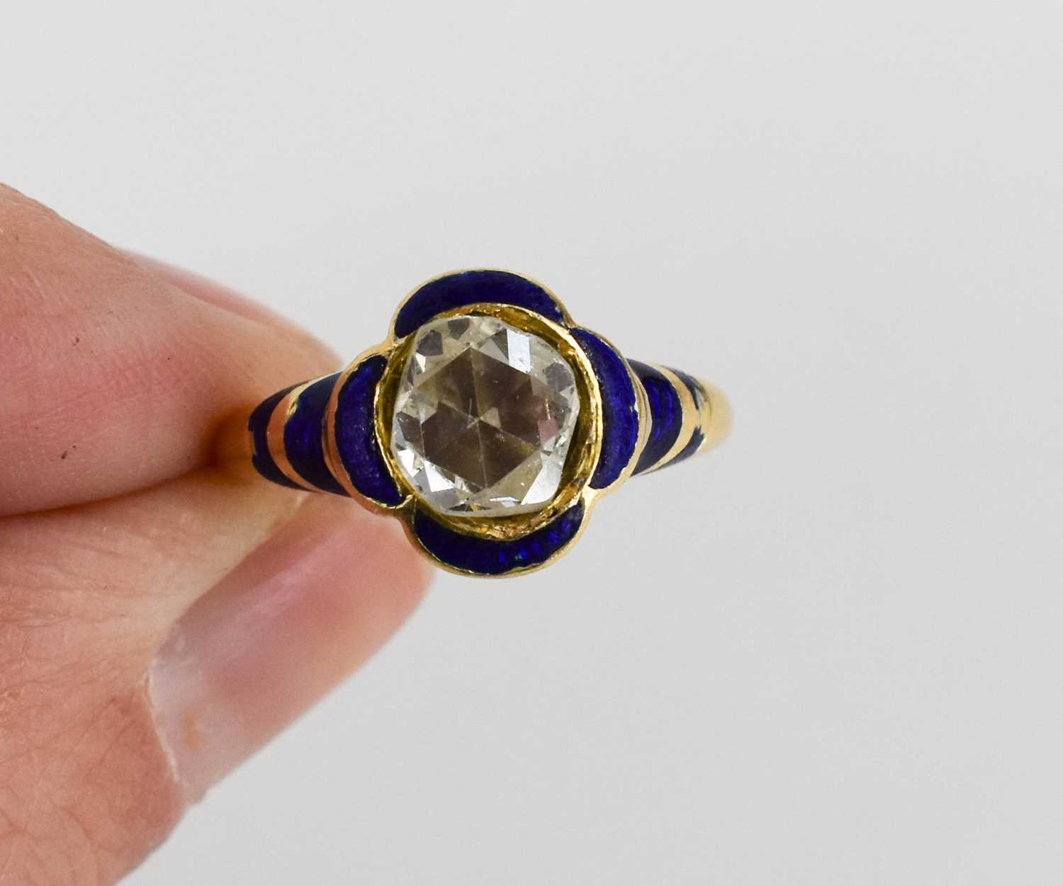 A gentleman's gold, diamond and enamel ring, with curved quatrefoil blue enamel surround to a - Image 2 of 2