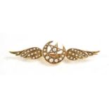 A seed pearl set brooch, of winged form with central crescent moon and star, 44mm long, unmarked,