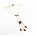 An Art Nouveau, Edwardian, 9ct gold and amethyst necklace, set with three suspended pear cut