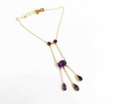 An Art Nouveau, Edwardian, 9ct gold and amethyst necklace, set with three suspended pear cut