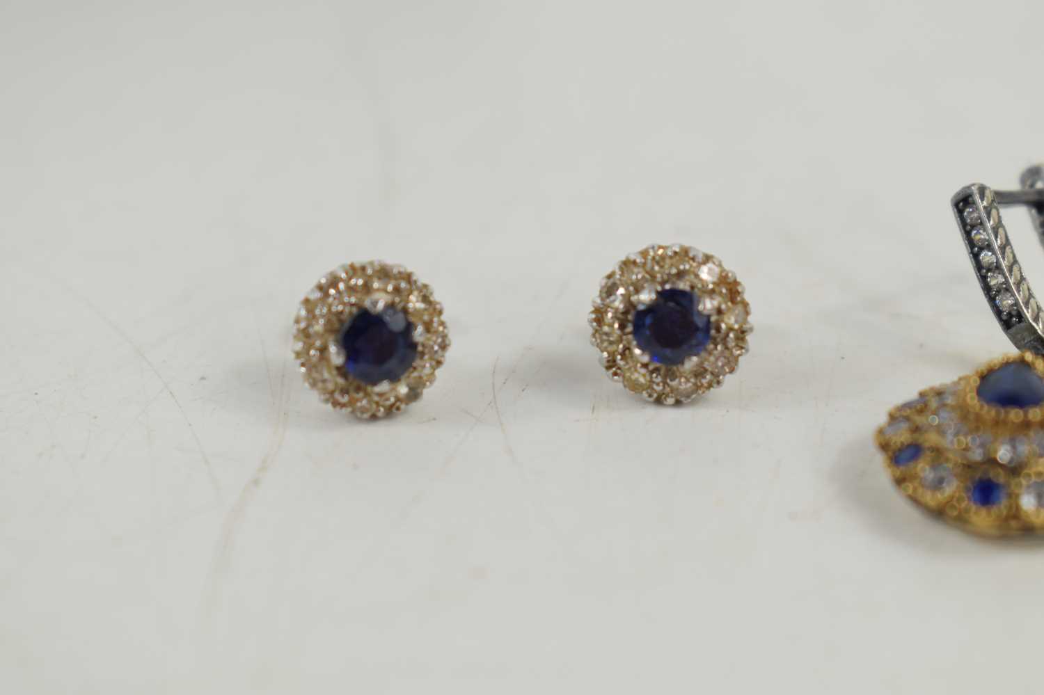A pair of sapphire and diamond earrings, each set with a central sapphire, approximately 4.4mm - Image 3 of 4