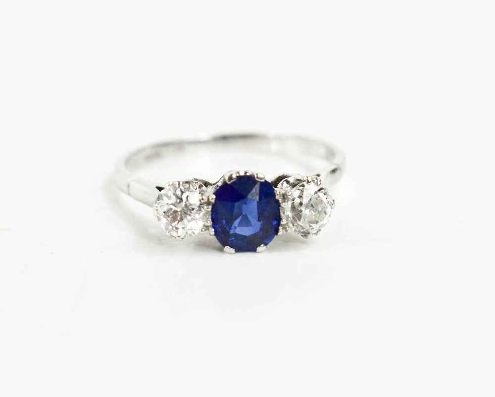 An 18ct white gold, diamond and sapphire ring, the two diamonds 0.3ct each, the cornflower blue - Image 2 of 4