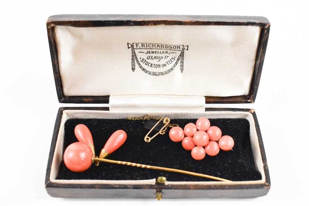 A 9ct gold and coral set stick pin, 6.44g including coral and a similar vintage coral brooch.