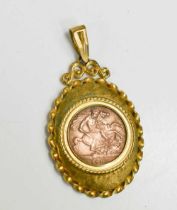 A copper Edward VII sovereign, dated 1902, in 9ct gold mount, total weight 7.9g.