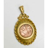 A copper Edward VII sovereign, dated 1902, in 9ct gold mount, total weight 7.9g.