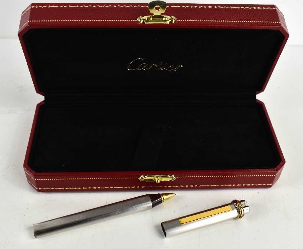 A Cartier ball point pen, with rose, yellow and white gold band to the pen lid, no.475802, in the - Image 4 of 5