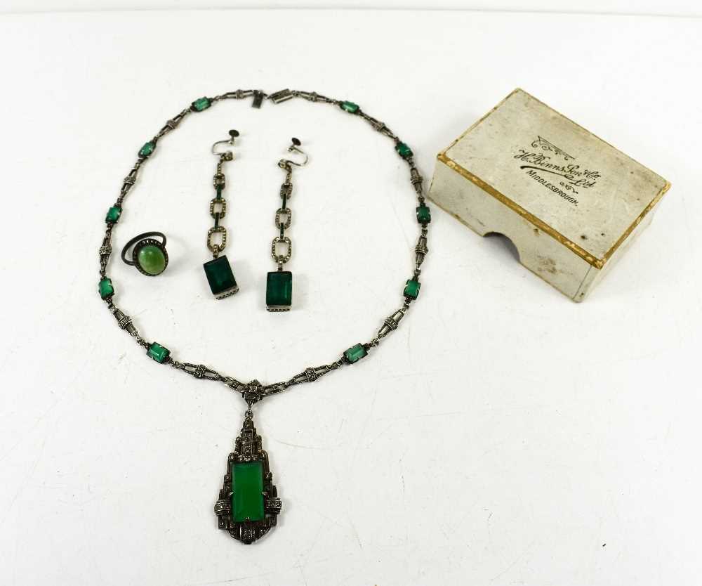 An Art Deco Continental 935 silver and green glass pendant necklace with similar earrings.