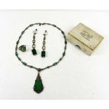 An Art Deco Continental 935 silver and green glass pendant necklace with similar earrings.