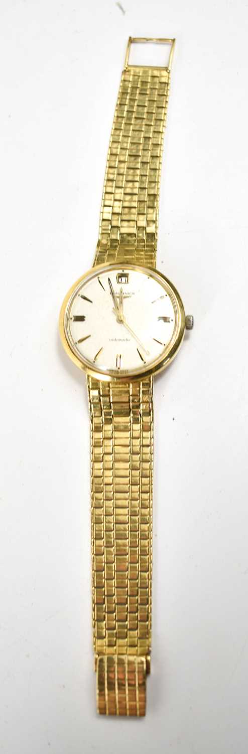 An 18ct gold Longines wristwatch, the dial having a calendar aperture and baton markers, with an