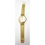 An 18ct gold Longines wristwatch, the dial having a calendar aperture and baton markers, with an