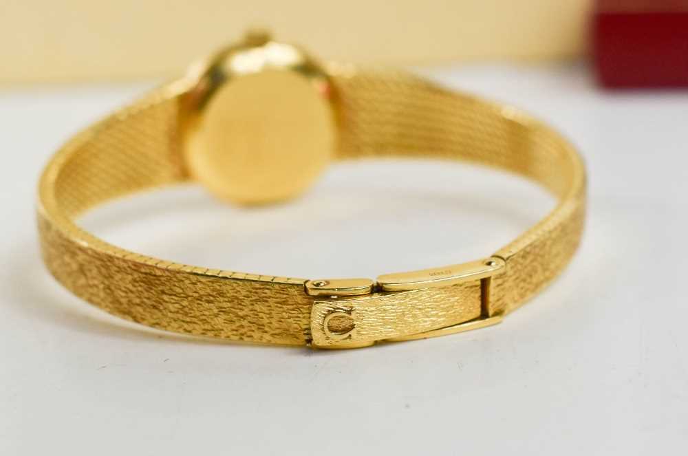 An 18ct gold Omega ladies wristwatch, the circular dial with baton markers, and a 18ct gold bark - Image 3 of 4