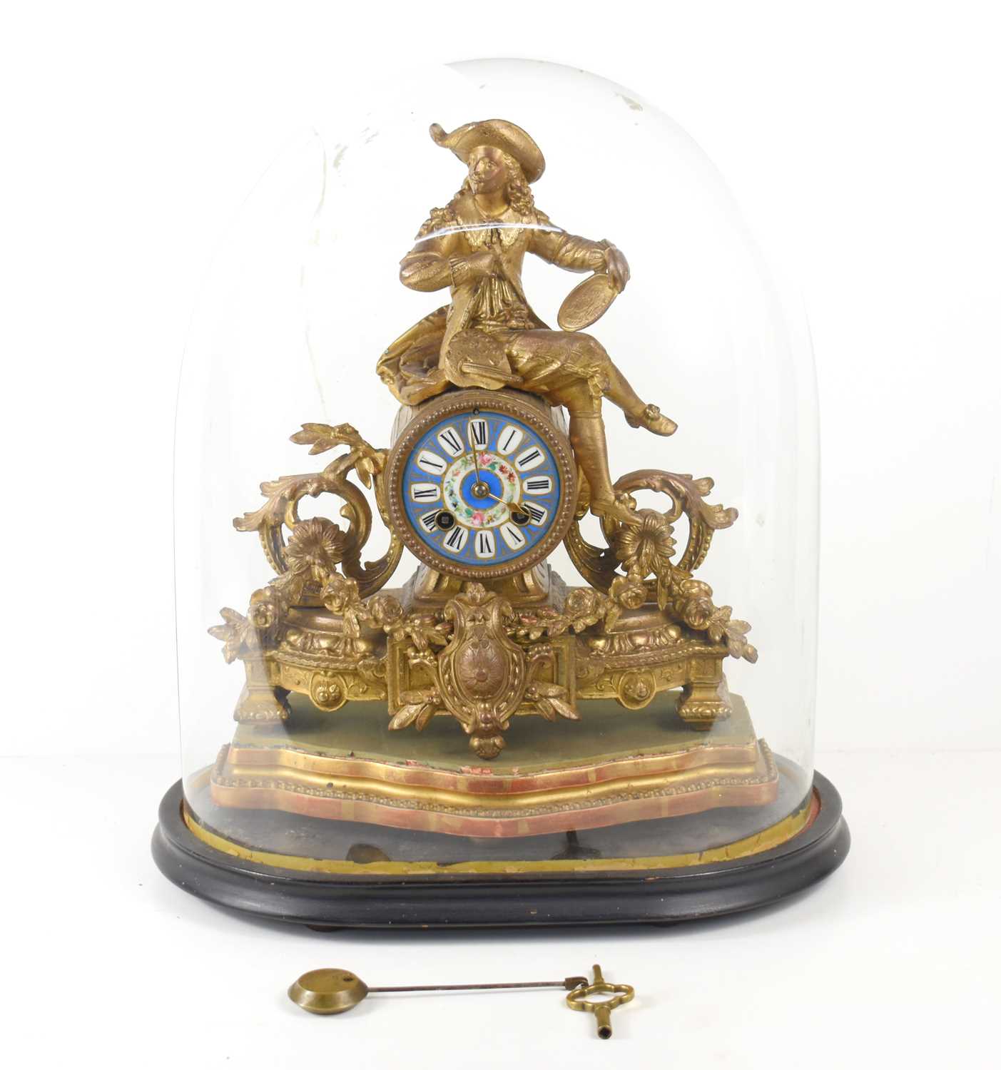 A 19th century French gilt metal mantle clock with Sevres dial, surmounted with the figure of a