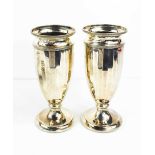 A pair of silver vases, The Northern Goldsmiths, Newcastle Upon Tyne, Birmingham 1949, 17cm high.
