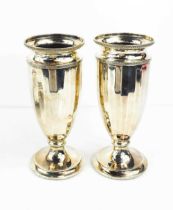 A pair of silver vases, The Northern Goldsmiths, Newcastle Upon Tyne, Birmingham 1949, 17cm high.