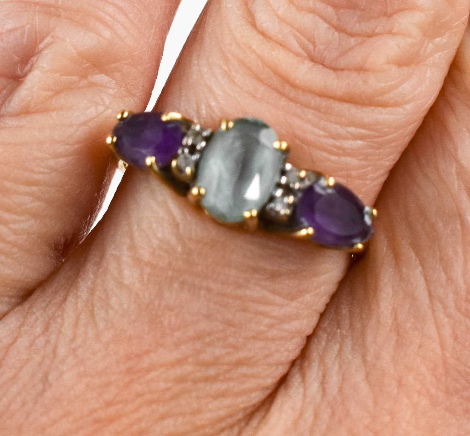 A 9ct gold, amethyst, aquamarine and diamond brilliant ring, the oval aquamarine, of approximately - Image 2 of 2