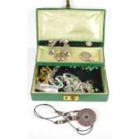 A silver charm bracelet with thirty two mostly silver charms together with a jewellery box and