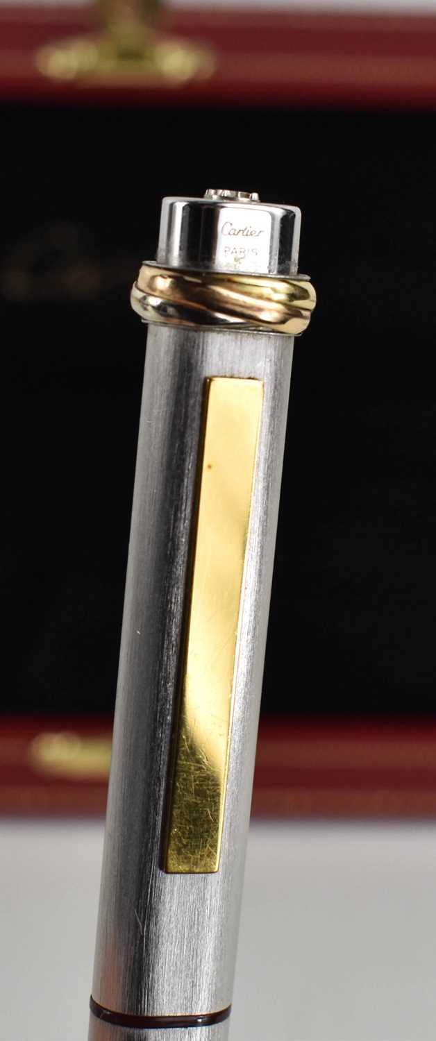 A Cartier ball point pen, with rose, yellow and white gold band to the pen lid, no.475802, in the - Image 5 of 5