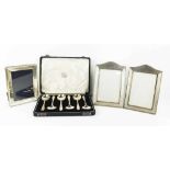 A set of six silver soup spoons, in the original presentation box, 6toz, together with a pair of