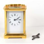 An early 29th century brass cased carriage clock, white dial with Roman numerals, the movement