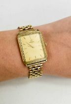 A gentleman's 9ct gold cased Omega dress watch, the signed champagne dial with baton numerals,