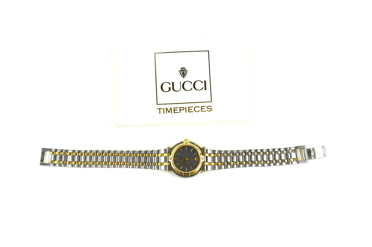 A lady's Gucci wristwatch, the signed black dial with baton numerals, date aperture at 6 o'clock,