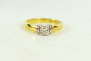 An 18ct gold and diamond solitaire ring, the diamond of approximately 4mm diameter, 0.25ct, with
