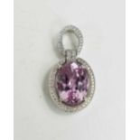 A Kunzite and diamond brilliant pendant set in 18ct white gold by Forum Design, the large oval cut