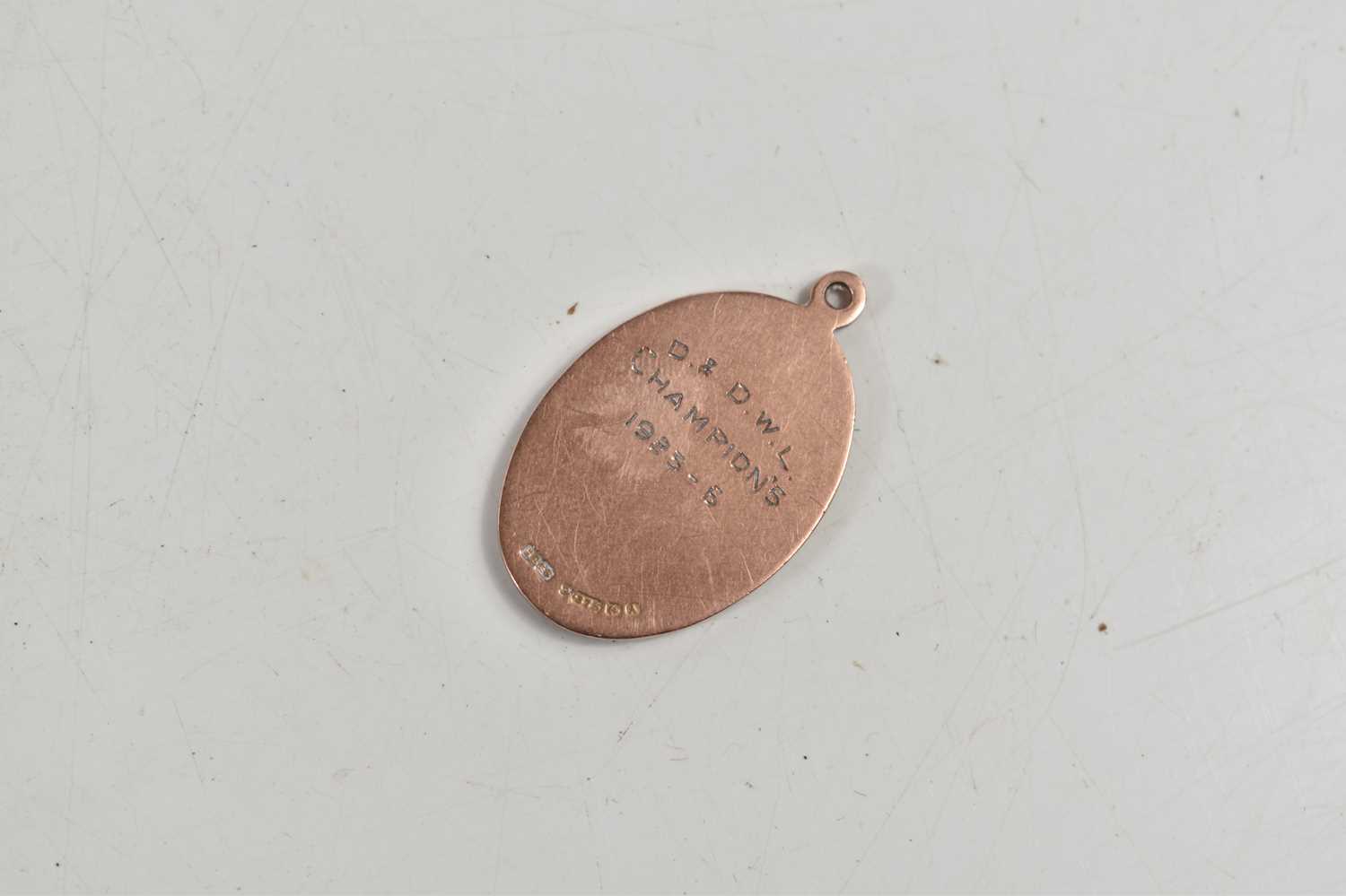 A 9ct gold fob medal pendant, D & D.W.L Champions 1925-26, 5.2g. - Image 2 of 2