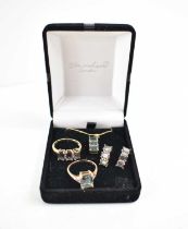 A suite of jewellery set in 9ct gold with diamond brilliants and iridescent green and pink stone,